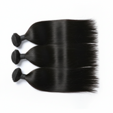 Butterfly Effect three bundles of straight black hair extensions on a white background